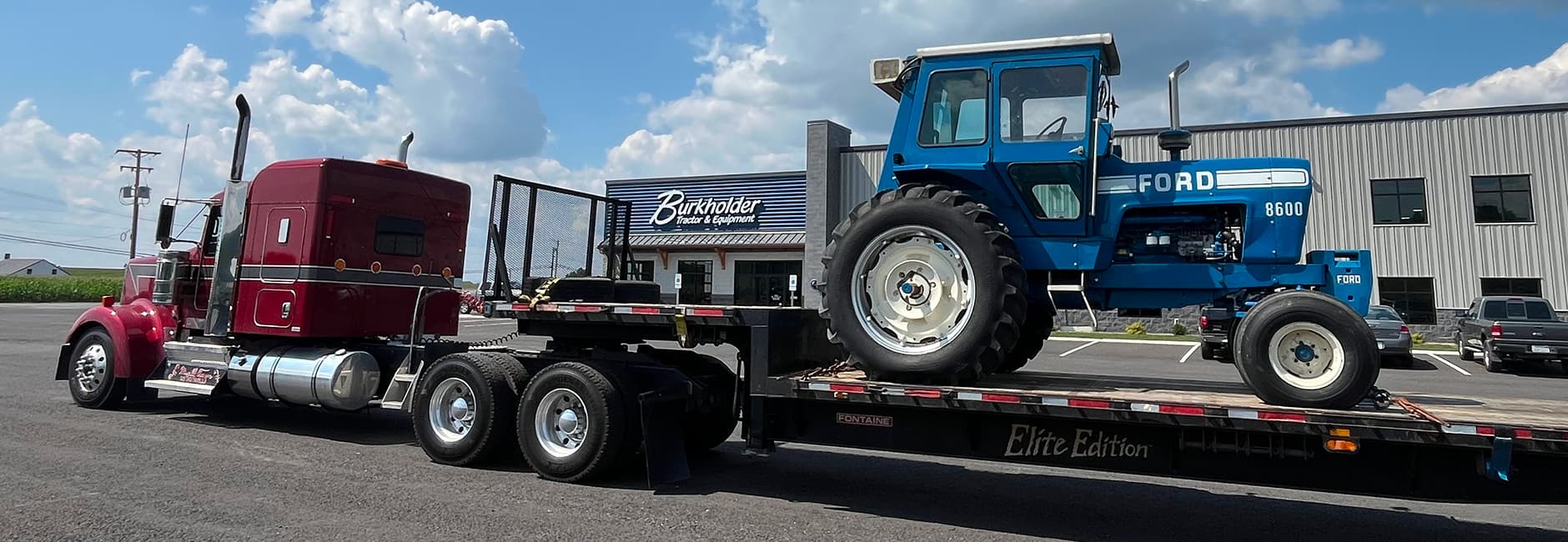 red turck with a blue tractor
