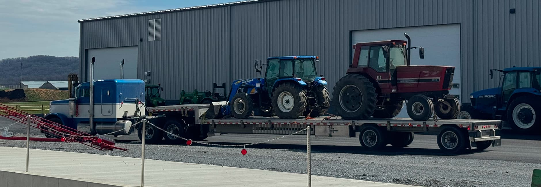 old truck with a red and blue tractor