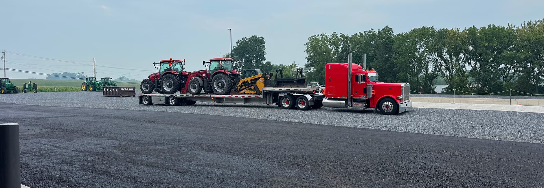 red prime movers towing tractors