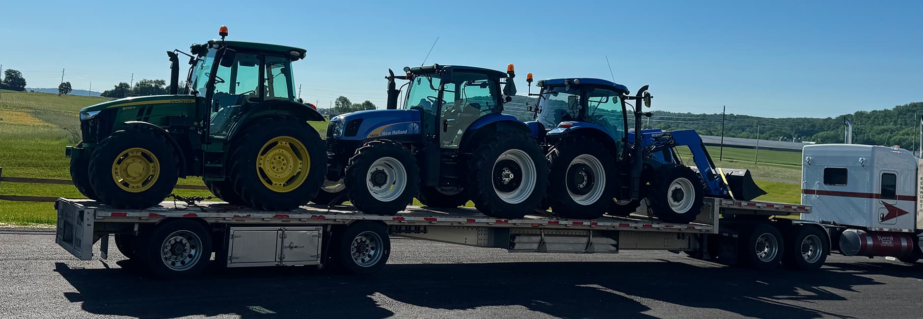 Blue tractors on a truck